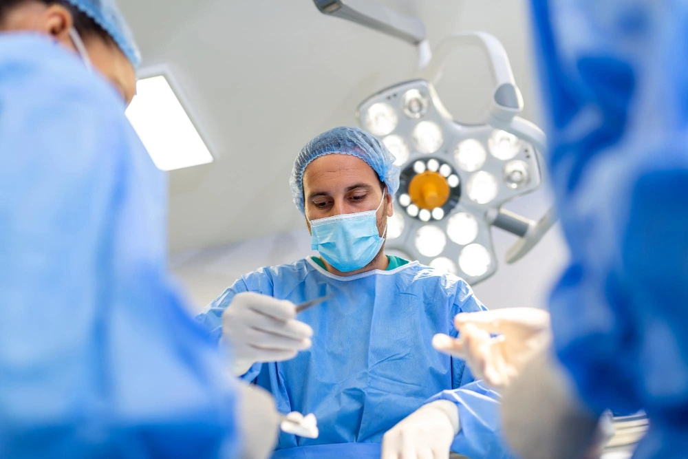 Surgeons working in a healthcare operating theatre