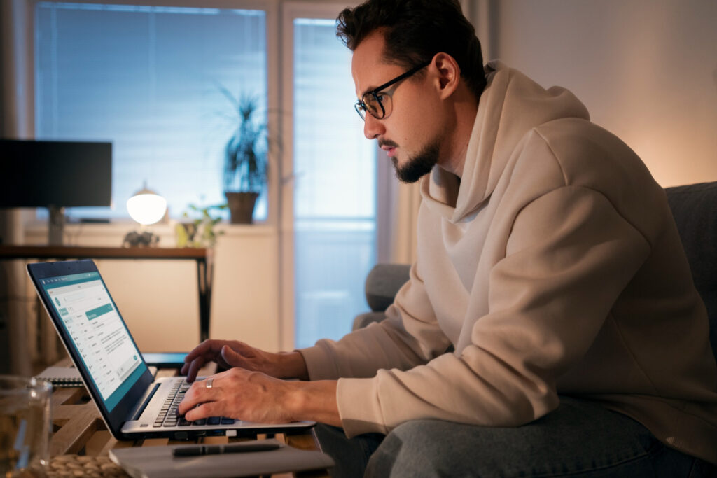 Professional reviewing new Business Central 2026 features on a laptop